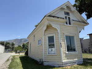 View of side of property featuring a mountain view