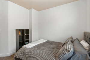 Bedroom with carpet flooring and baseboards