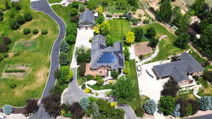 Aerial view of property's location featuring nearby suburban area