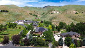 Aerial overview of property's location featuring a mountain backdrop