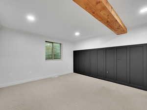 Below grade bedroom featuring with recessed lighting and carpet floors