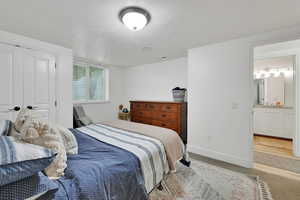 Bedroom #3 Carpeted bedroom featuring a textured ceiling and ensuite bathroom