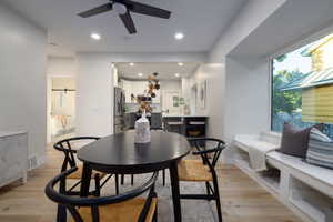 Dining area featuring a ceiling fan, light wood-style floors, and recessed lighting