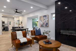 Living area featuring light wood finished floors, recessed lighting, healthy amount of natural light, and ceiling fan