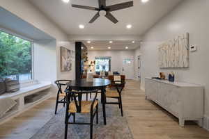 Dining space featuring a ceiling fan, plenty of natural light, light wood-style floors, and recessed lighting