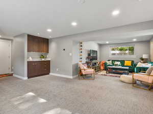 Living room featuring light colored carpet and recessed lighting