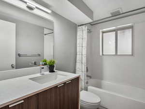 Full bath with vanity and shower / bathtub combination with curtain