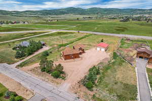 Overview of rural landscape with a mountain backdrop