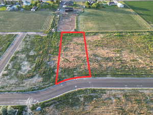 Aerial view of property and surrounding area featuring property boundaries highlighted and rural landscape