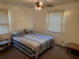 Bedroom with carpet flooring and a ceiling fan