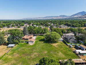 Aerial perspective of suburban area with a mountain backdrop