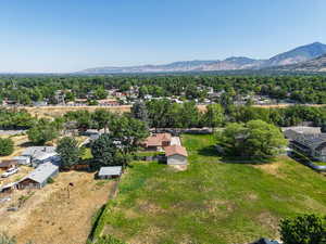 Aerial perspective of suburban area with a mountain backdrop