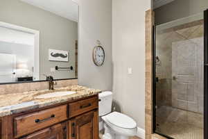 Ensuite bathroom with vanity and a stall shower