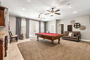 Playroom with billiards table, french doors, recessed lighting, light tile patterned flooring, and ceiling fan