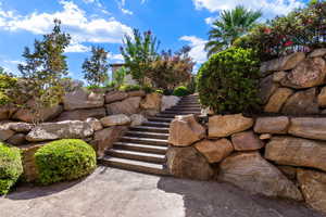 View of yard featuring stairway