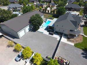 Aerial perspective of suburban area featuring a pool area