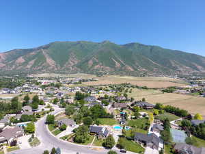 Aerial view of property's location with a mountain backdrop