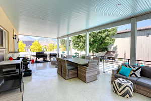 View of patio featuring outdoor dining area and a mountain view
