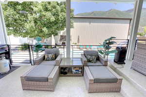Patio / terrace with an outdoor hangout area and a mountain view