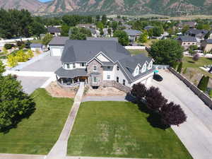 Aerial perspective of suburban area featuring a mountain backdrop