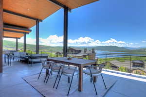 Patio / terrace featuring outdoor lounge area and a water and mountain view