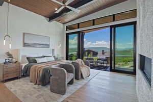 Bedroom with wooden ceiling, wood finished floors, and access to outside