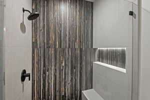 Bathroom with tiled shower