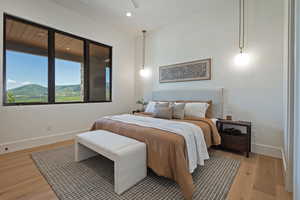 Bedroom with light wood-style flooring and recessed lighting