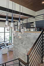 Stairs featuring wooden ceiling and wood finished floors