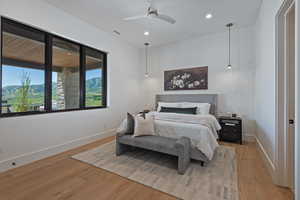 Bedroom featuring light wood-style floors, recessed lighting, and a ceiling fan