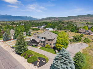 Aerial view of residential area featuring a mountainous background