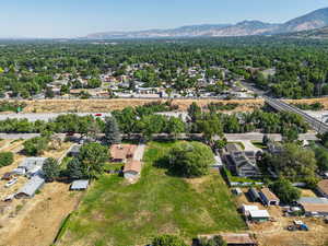 View of property location with a mountainous background and nearby suburban area