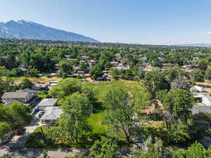 Aerial view of residential area featuring a mountainous background