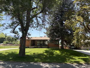 View of front of home with brick siding and concrete driveway