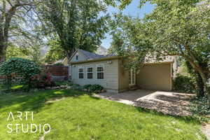 Rear view of house featuring a patio area and entry steps