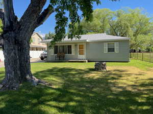 View of front of house featuring a porch and roof with shingles