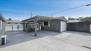 View of patio / terrace featuring concrete driveway