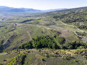 Aerial overview of property's location featuring a mountainous background