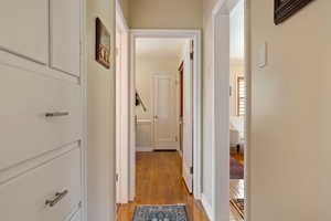 Corridor with light wood finished floors