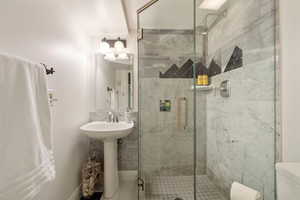 Full bathroom with a shower stall and tile patterned floors