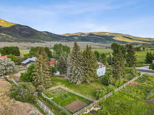 View of mountain backdrop featuring rural landscape