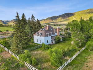 View of subject property featuring a mountainous background