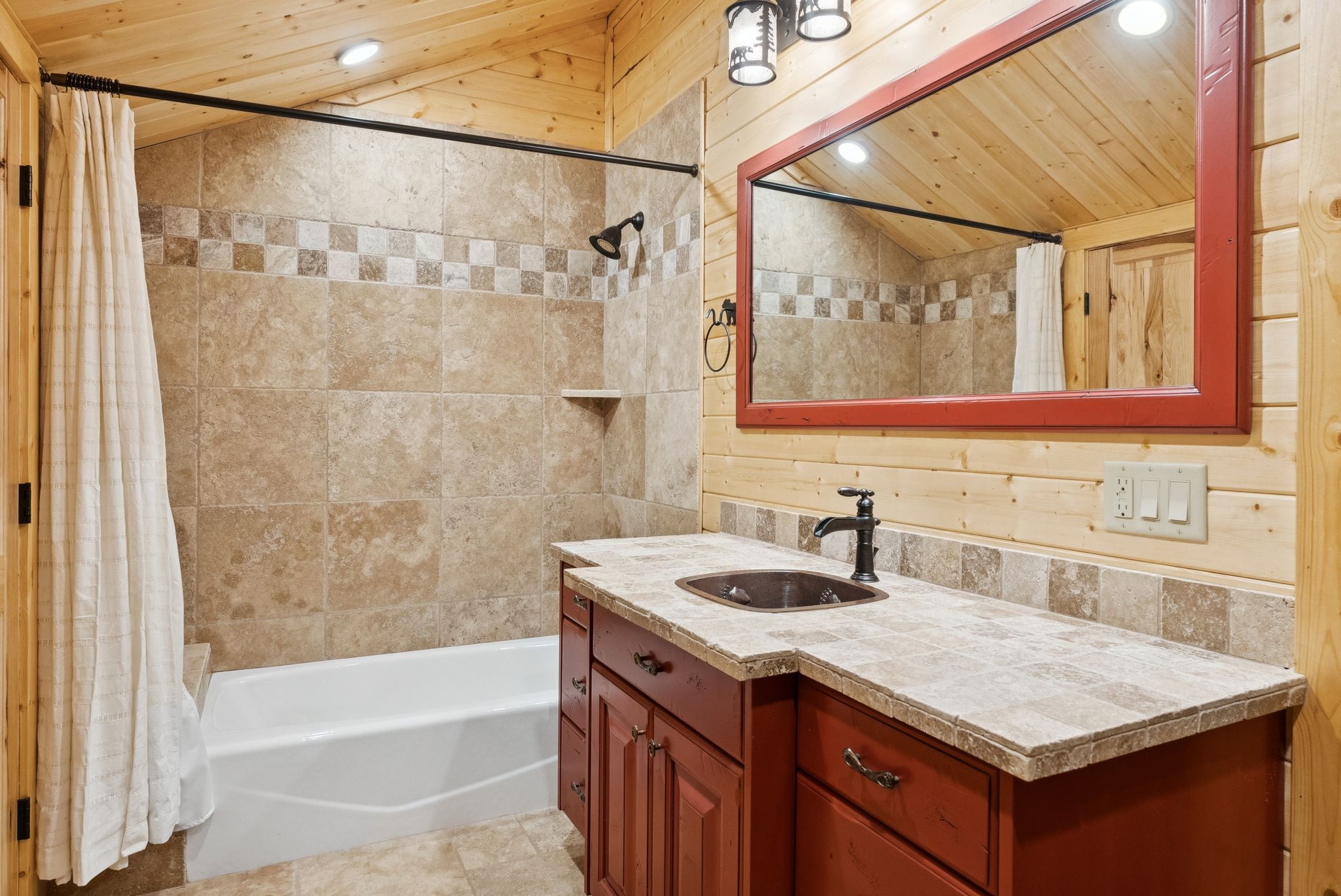 Bathroom with vaulted ceiling, tongue-in-groove ceiling, vanity, recessed lighting, and shower / bath combination with curtain