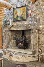 Detailed view of a wood stove and rustic walls