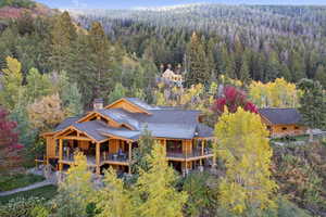 View of subject property featuring a forest