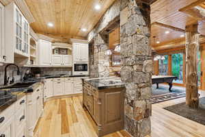 Kitchen featuring wooden ceiling, light wood-style flooring, recessed lighting, billiards table, and decorative backsplash