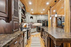 Kitchen with open shelves, wood ceiling, black appliances, light wood-style floors, and recessed lighting
