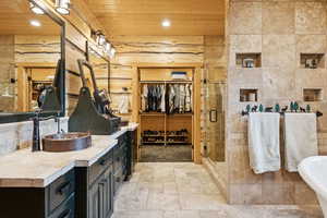 Bathroom featuring vanity, wood ceiling, a shower stall, recessed lighting, and a freestanding tub