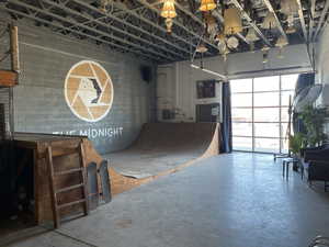 Misc room featuring concrete floors and a garage