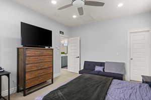 Carpeted bedroom featuring attic access, recessed lighting, a ceiling fan, and baseboard heating
